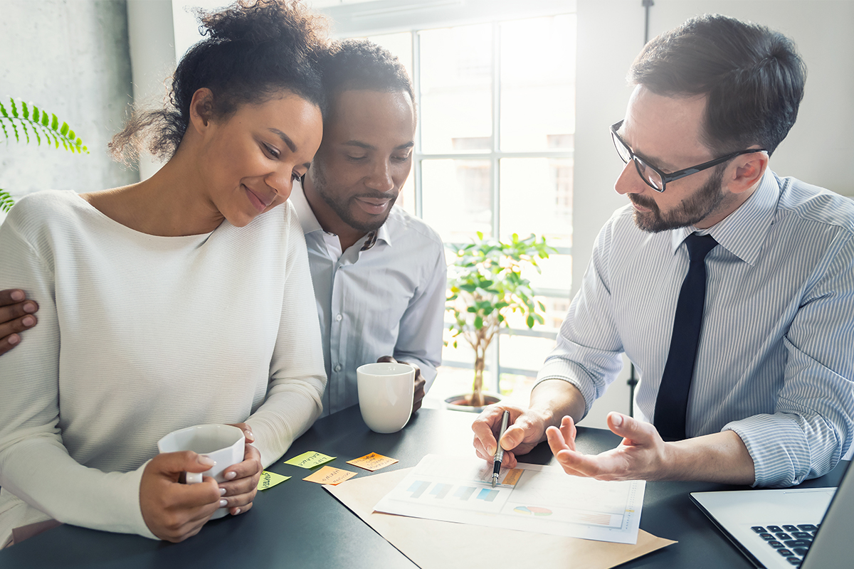Couple with Financial Advisor at Neuenschwander Asset Management